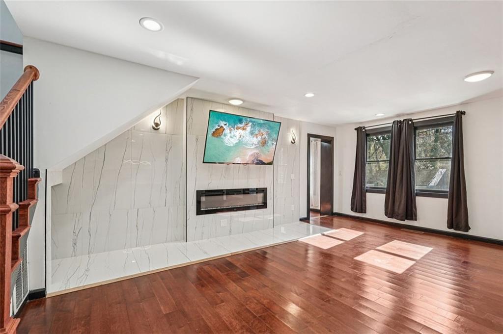 1689 Derry Avenue Southwest Atlanta, GA 30310 - Photo 6 of 51 a view of an empty room with window and fire place