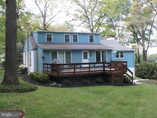 3015 Swamp Road Doylestown, PA 18902 - Photo 2 of 6 a view of a house with a yard deck and a large tree