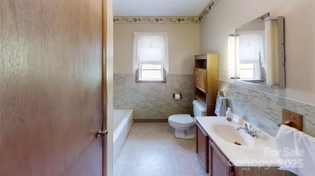 a kitchen with stainless steel appliances granite countertop a refrigerator sink and cabinets