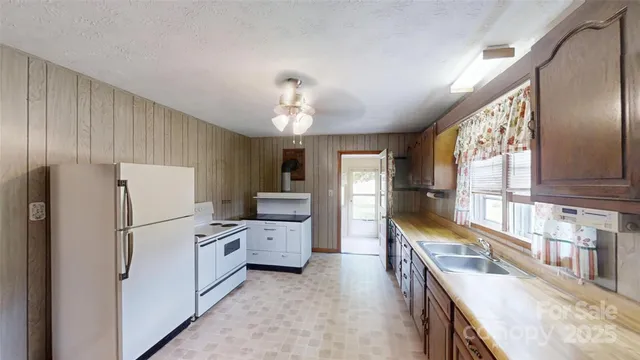 a view of an empty room with wooden walls