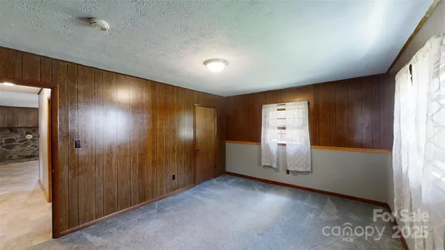 a bathroom with a shower and a sink