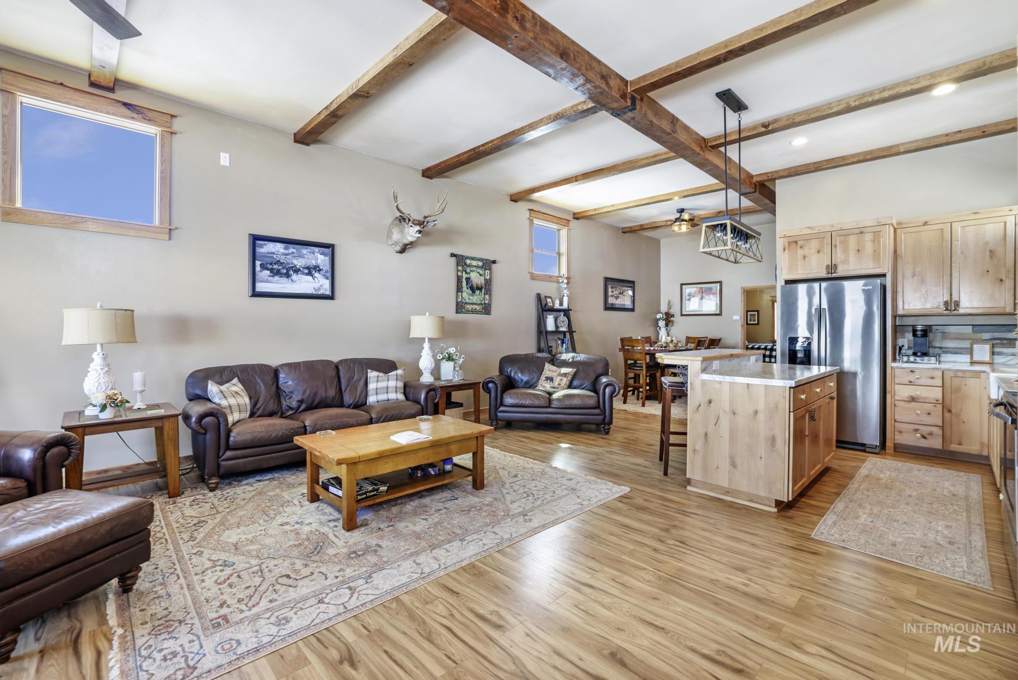 203 North Brush Road Fairfield, ID 83327 - Photo 43 of 50 Living room with beamed ceiling, light wood-type flooring, ceiling fan, and recessed lighting