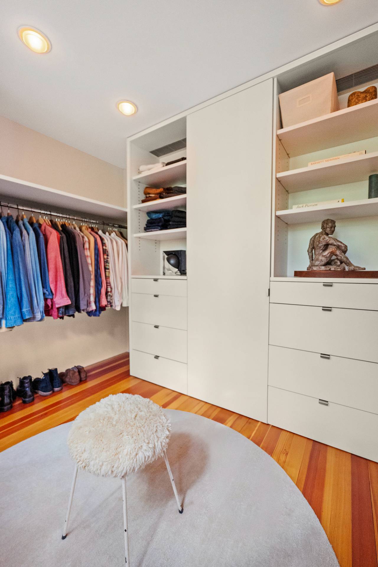 1052 Noyac Path Water Mill, NY 11976 - Photo 18 of 35 a view of walk in closet with clothes and shoes