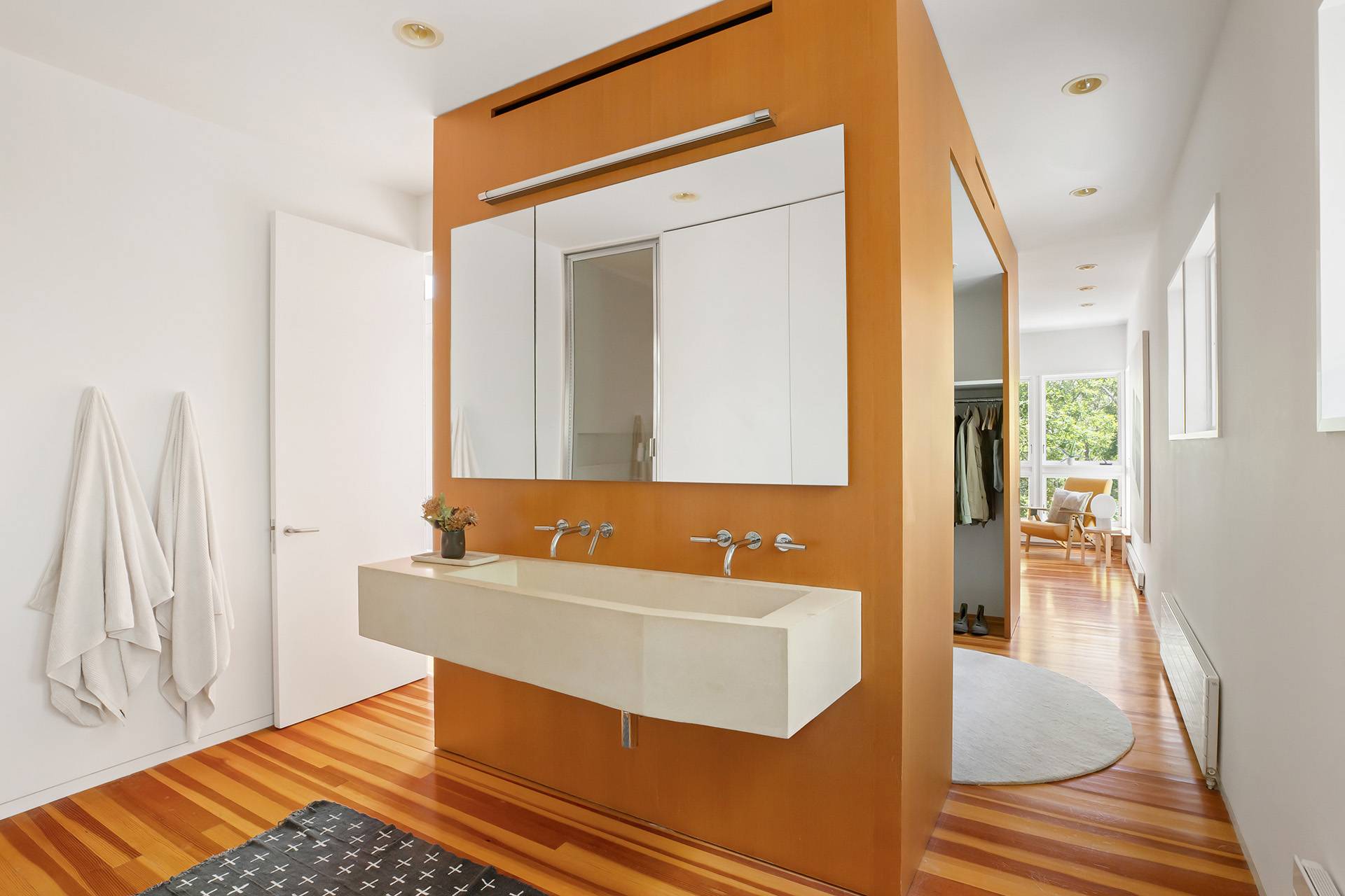 1052 Noyac Path Water Mill, NY 11976 - Photo 19 of 35 a bathroom with a sink a mirror and a bathtub