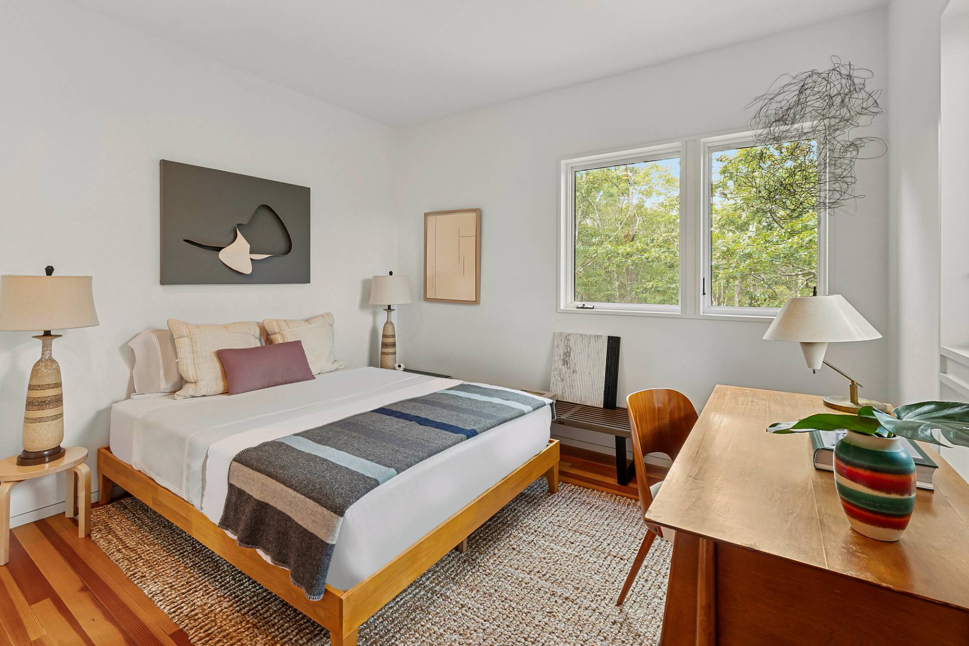 1052 Noyac Path Water Mill, NY 11976 - Photo 26 of 35 a bedroom with a bed and a potted plant