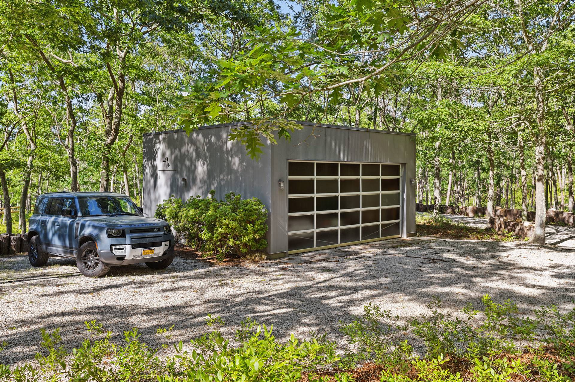 1052 Noyac Path Water Mill, NY 11976 - Photo 34 of 35 a front view of a house with a garden