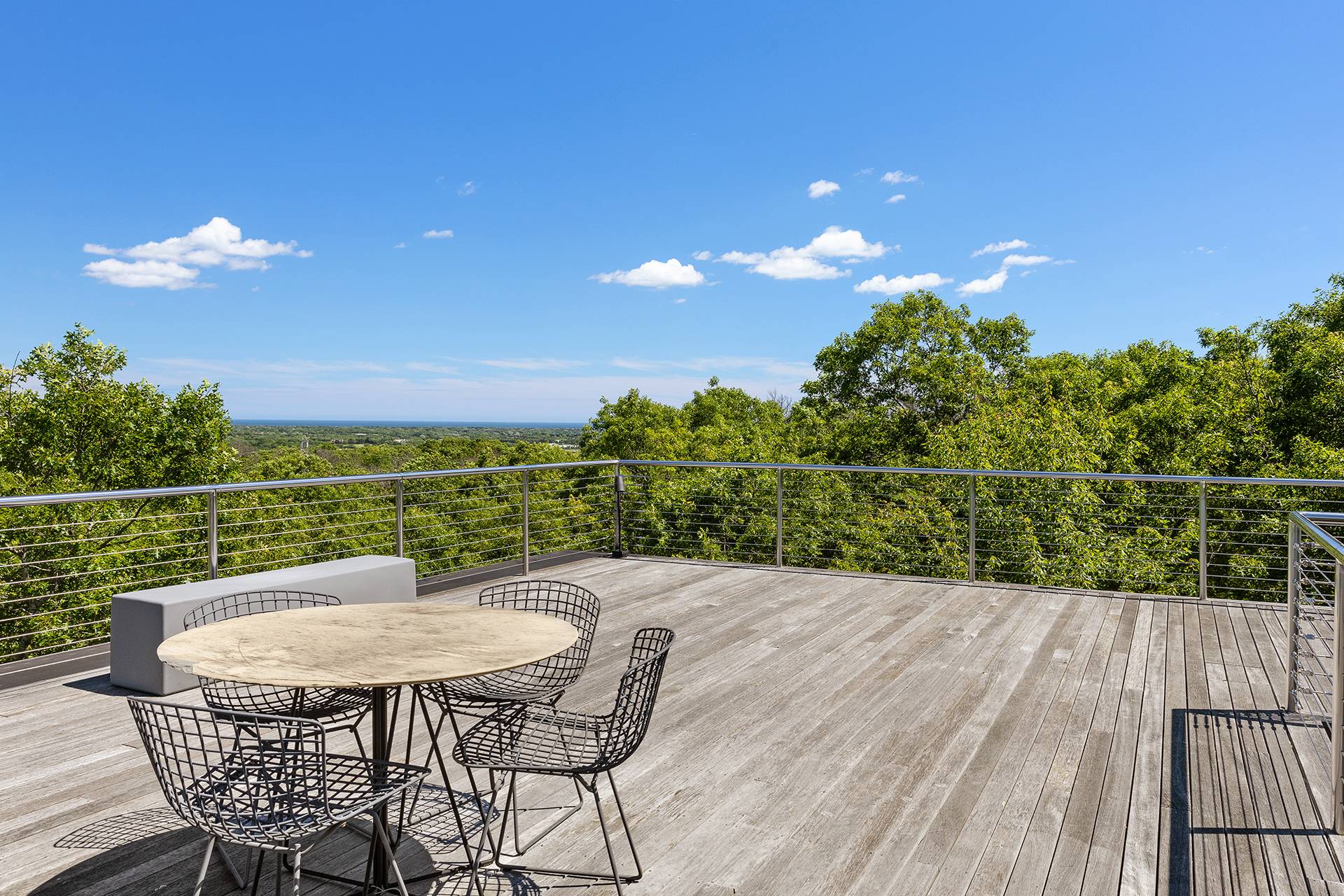 1052 Noyac Path Water Mill, NY 11976 - Photo 4 of 35 a view of a chairs and table on the wooden floor