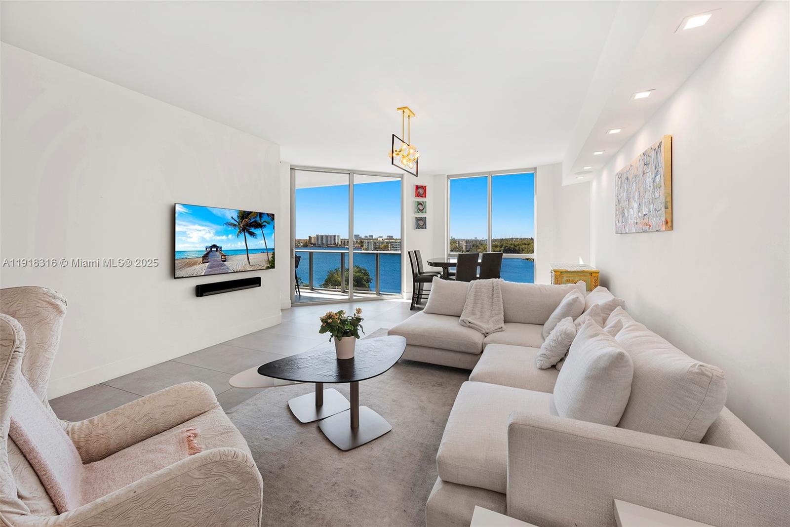 a living room with furniture and a flat screen tv
