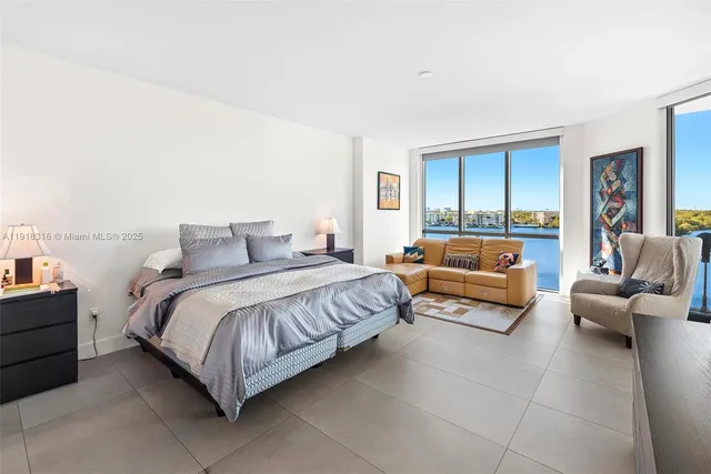 a bedroom with a bed and couch