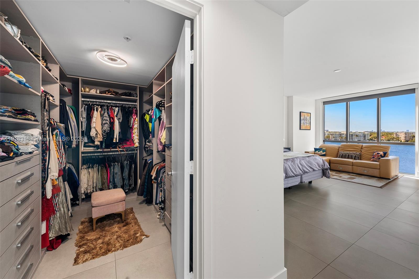 17111 Biscayne Boulevard, Unit 606 North Miami Beach, FL 33160 - Photo 19 of 36 a living room with furniture and a couch