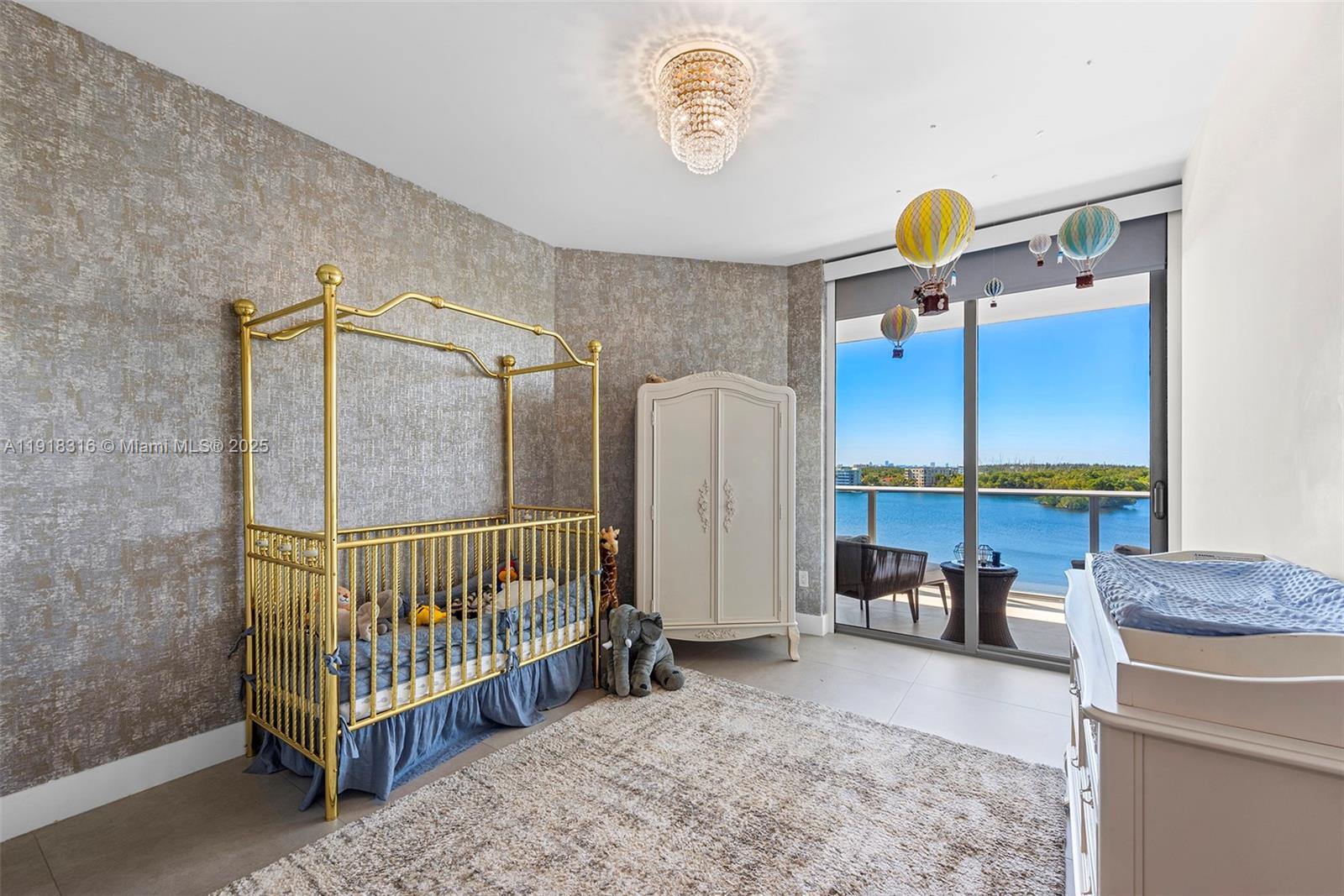 17111 Biscayne Boulevard, Unit 606 North Miami Beach, FL 33160 - Photo 24 of 36 a bedroom with furniture and a window