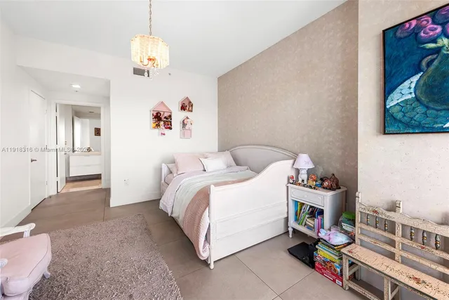 a bed room with a bed and a book shelf