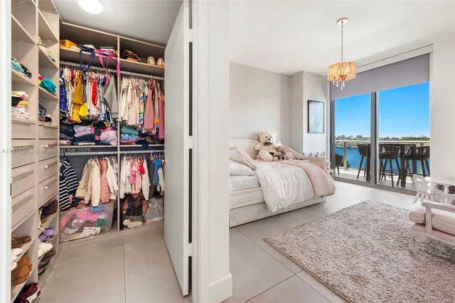 a bed room with a bed and a walk in closet