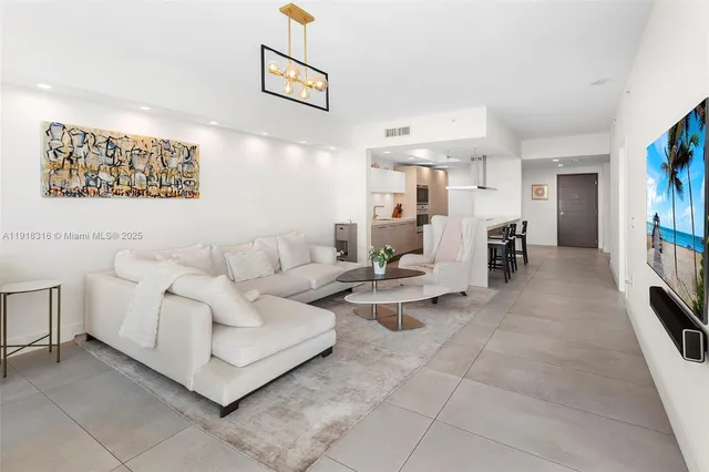 a living room with furniture and a table