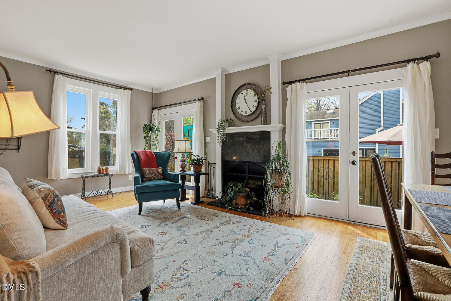 6023 Sentinel Drive Raleigh, NC 27609 - Photo 5 of 53 a living room with furniture a large window and a fireplace