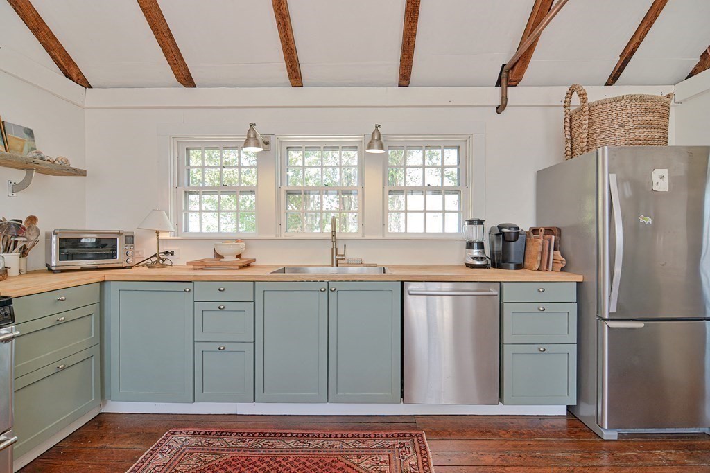 1904 Main Road Westport, MA 02791 - Photo 19 of 42 a kitchen with a sink cabinets stainless steel appliances and a window