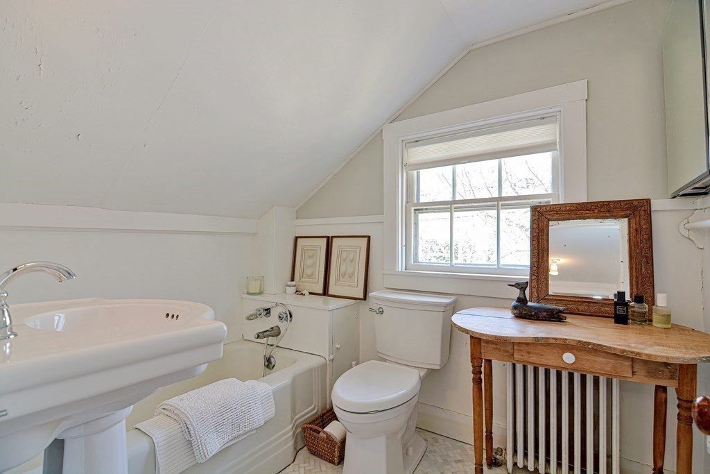 1904 Main Road Westport, MA 02791 - Photo 25 of 42 a bathroom with a toilet a sink and a bathtub