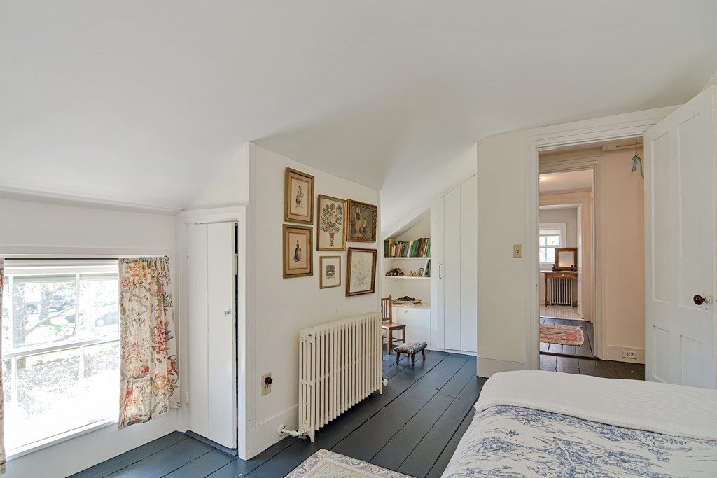 1904 Main Road Westport, MA 02791 - Photo 27 of 42 a view of a bedroom with wooden floor and windows