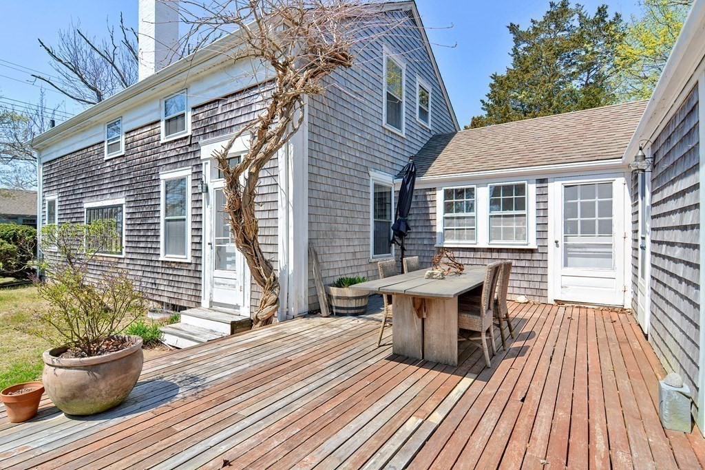 1904 Main Road Westport, MA 02791 - Photo 32 of 42 a view of a house with wooden deck and furniture