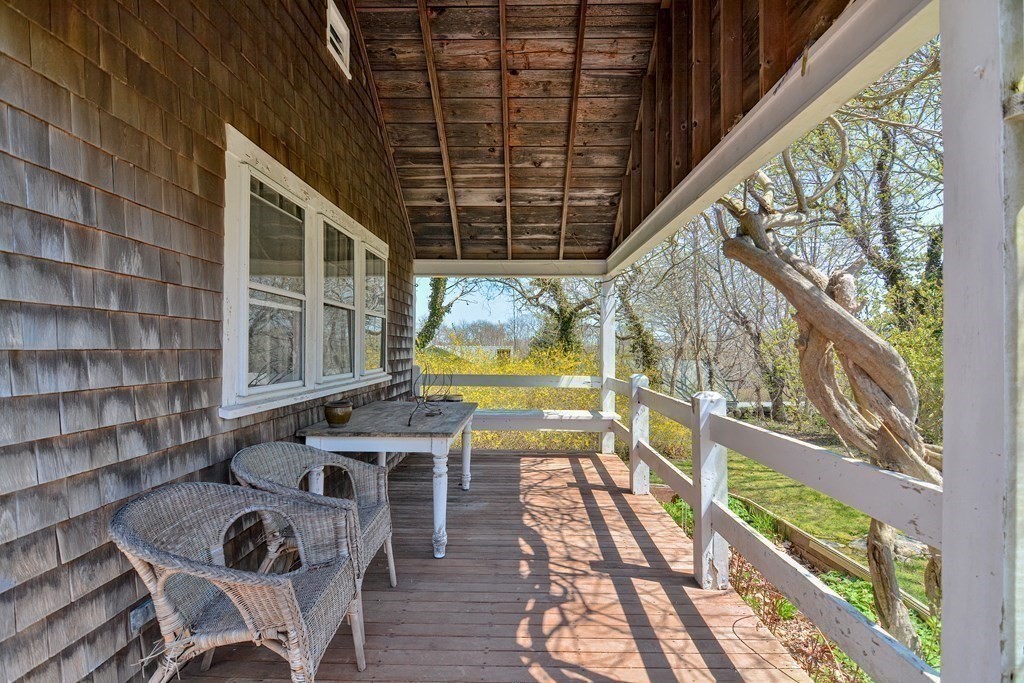 1904 Main Road Westport, MA 02791 - Photo 33 of 42 a view of balcony with a table and chairs