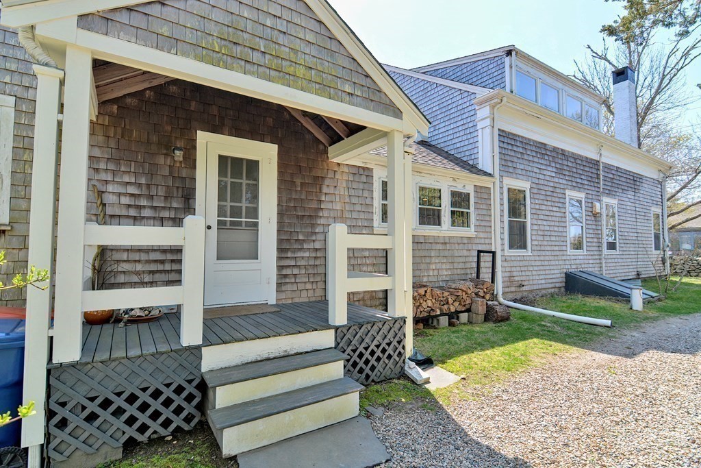 1904 Main Road Westport, MA 02791 - Photo 36 of 42 a front view of a house with a yard