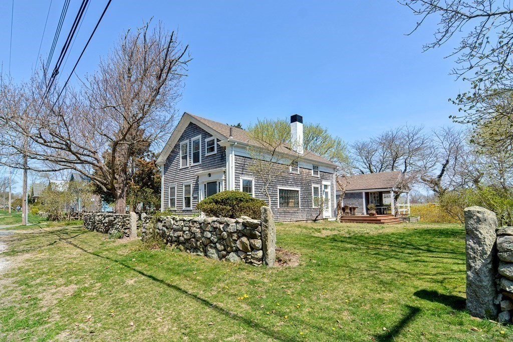 1904 Main Road Westport, MA 02791 - Photo 4 of 42 a front view of a house with a yard