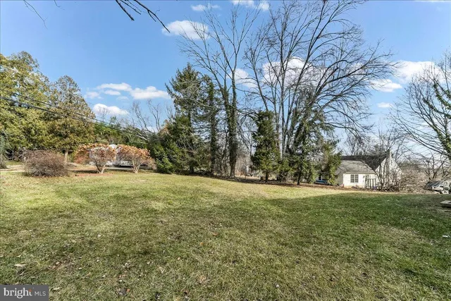 a view of a trees in front of a house
