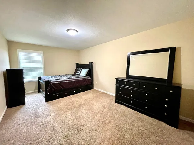 a room with furniture and a flat screen tv