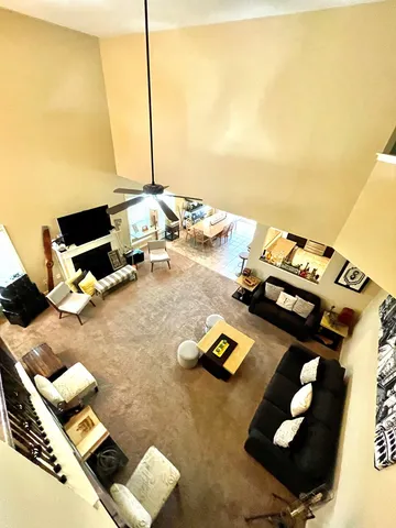 a living room with furniture and next to a window