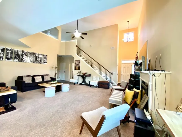 a view of a living room with furniture and a couch