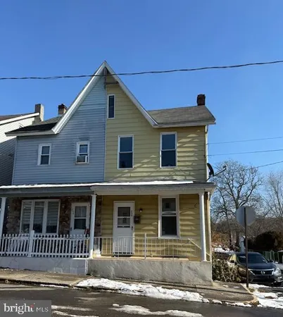 a front view of a house with a garage
