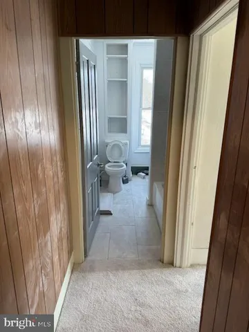 a view of a hallway with windows