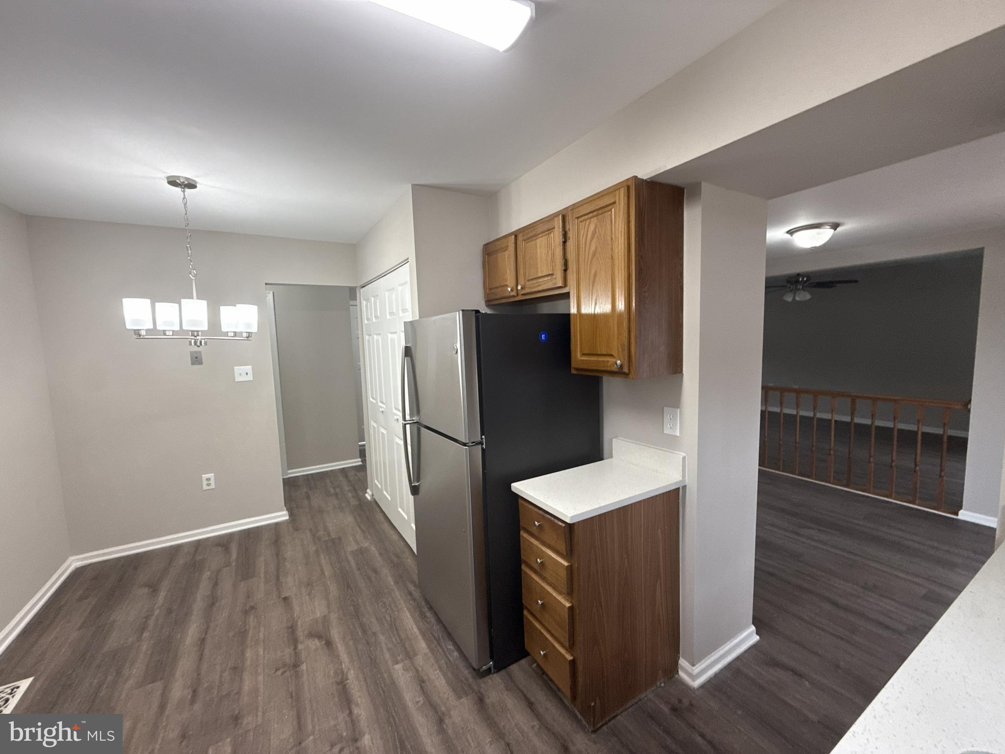 7604 Fox Hunt Court Clinton, MD 20735 - Photo 7 of 14 a kitchen with stainless steel appliances wooden floor and view living room
