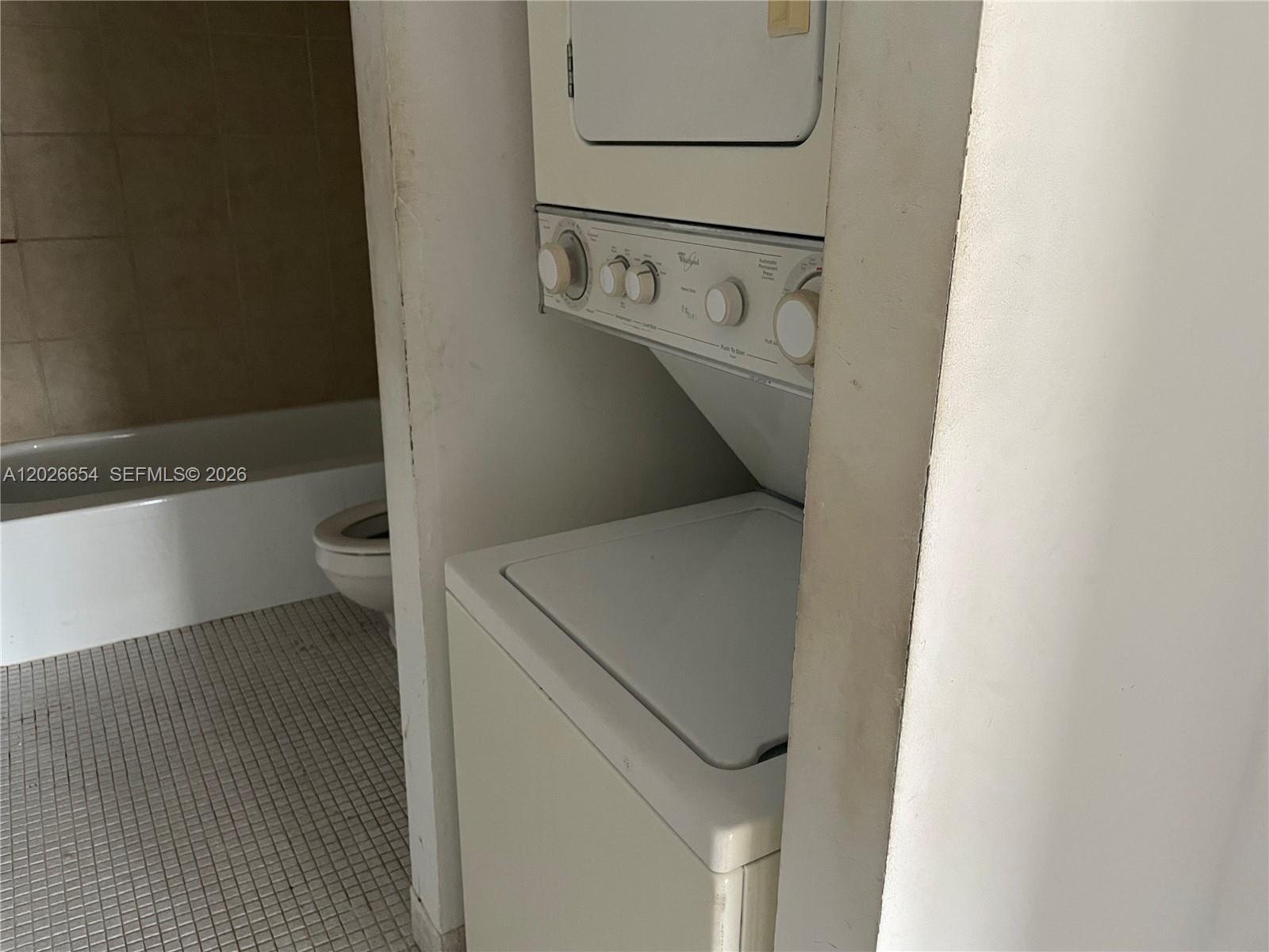 4174 Inverrary Drive, Unit 903 Lauderhill, FL 33319 - Photo 18 of 36 a utility room with dryer and washer