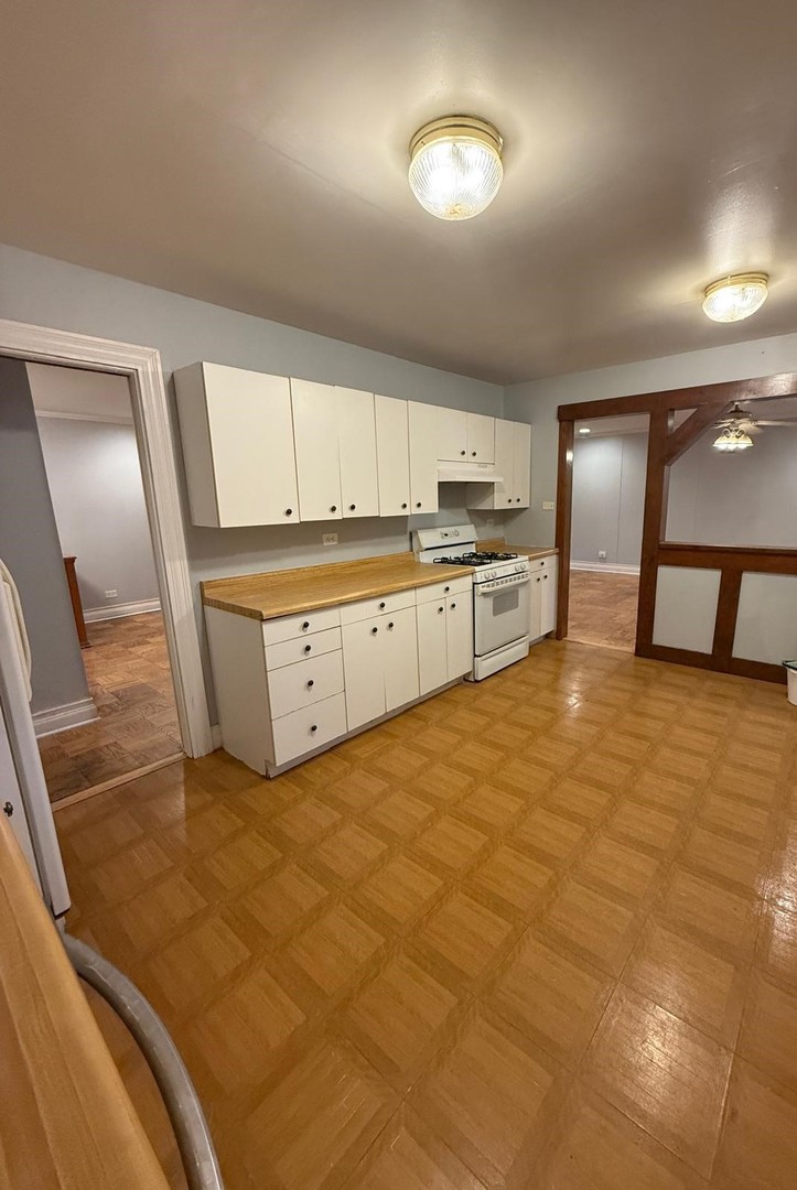 1440 Gentry Road Hoffman Estates, IL 60169 - Photo 6 of 15 a large kitchen with stainless steel appliances granite countertop a stove a sink and a refrigerator