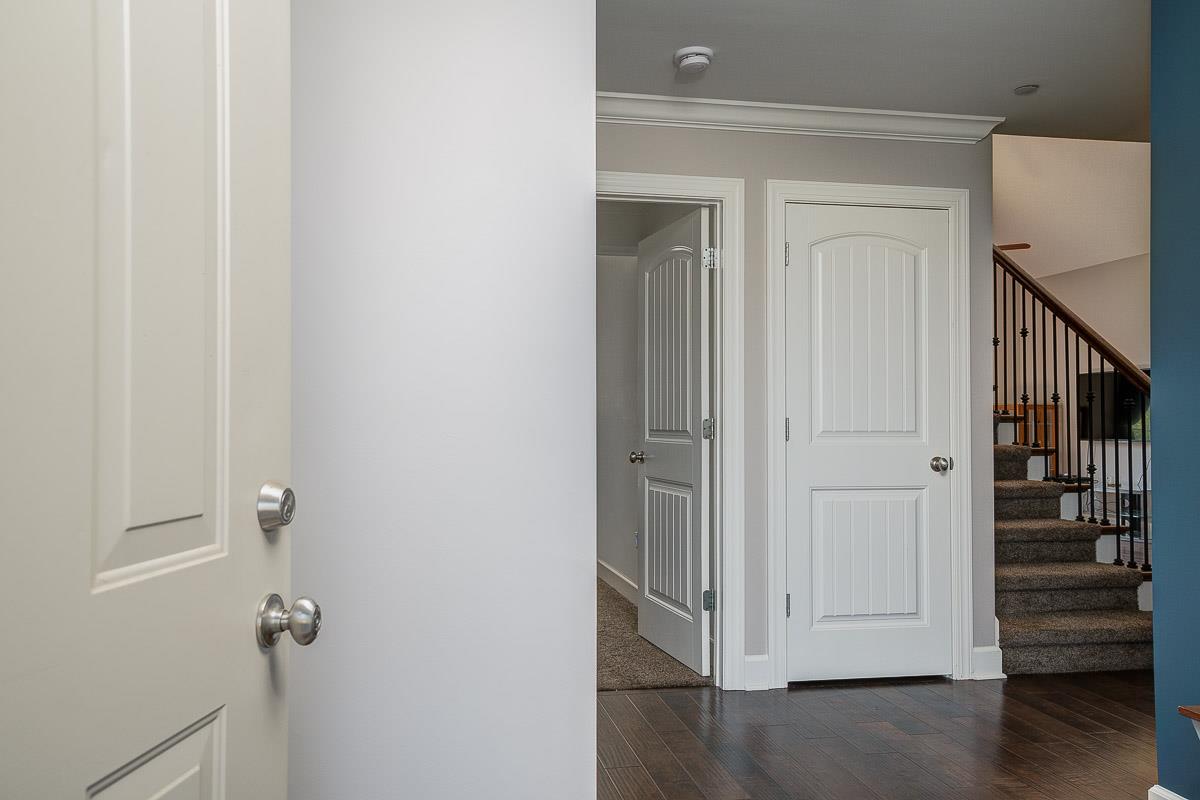 1021 Irish Way Spring Hill, TN 37174 - Photo 3 of 22 a view of a hallway with wooden floor and entryway