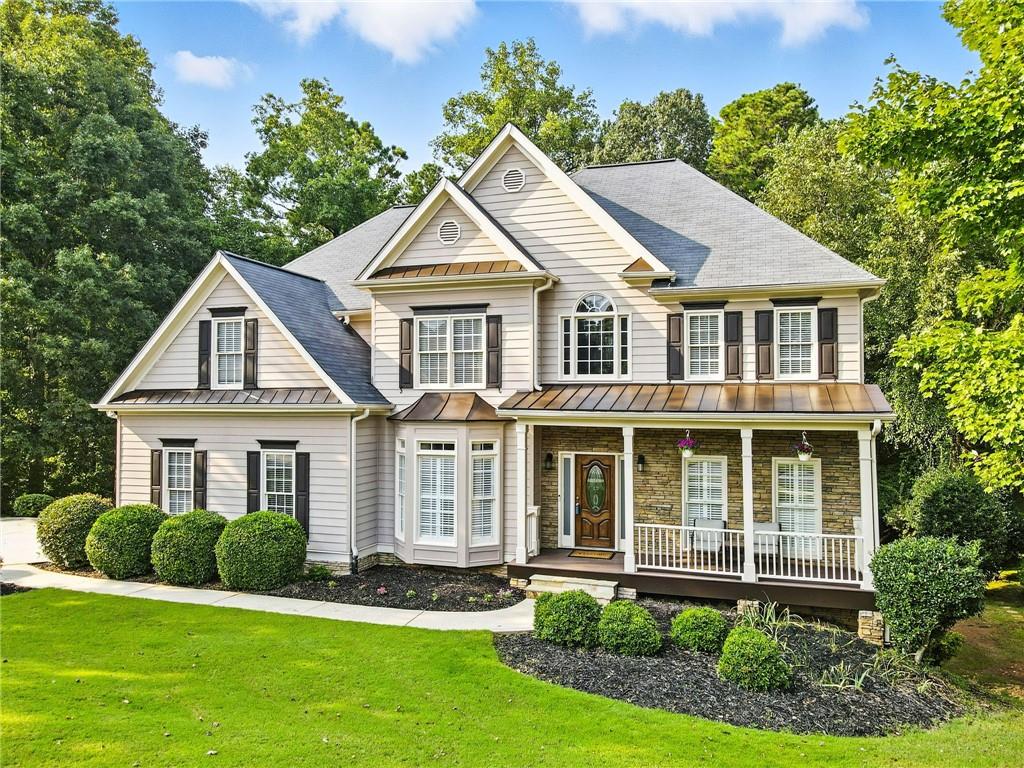 629 Gold Valley Pass Canton, GA 30114 - Photo 1 of 110 a front view of a house with a yard
