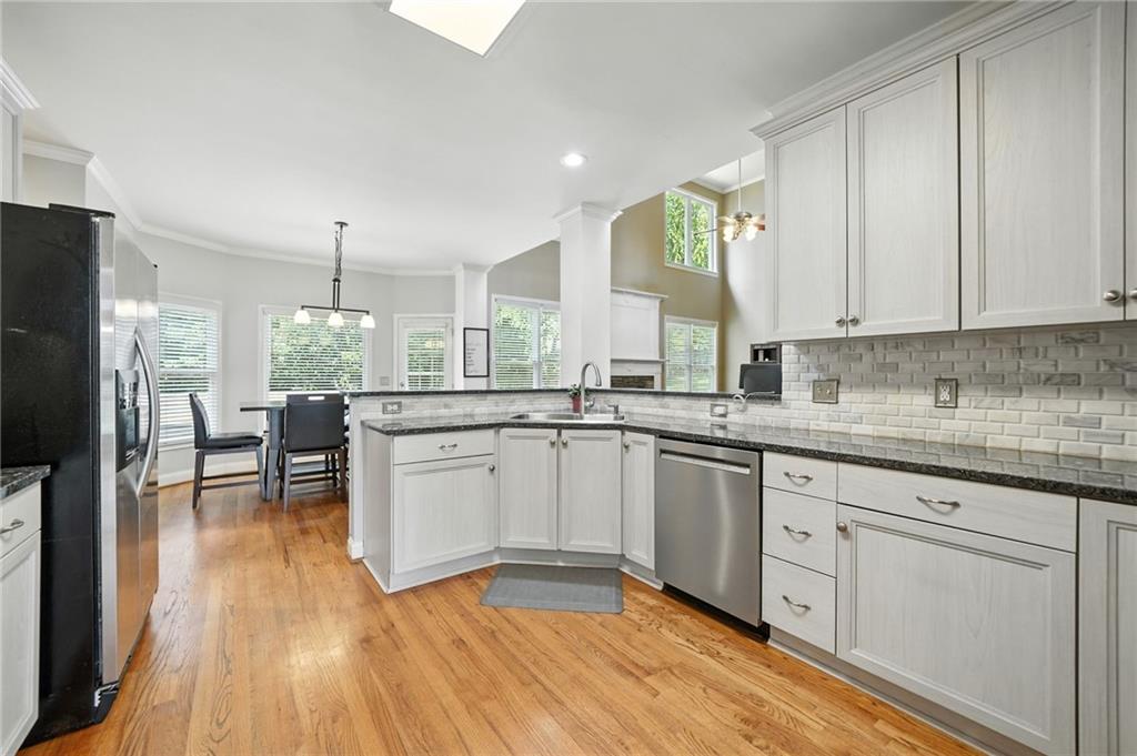 629 Gold Valley Pass Canton, GA 30114 - Photo 13 of 110 a kitchen with white cabinets and sink