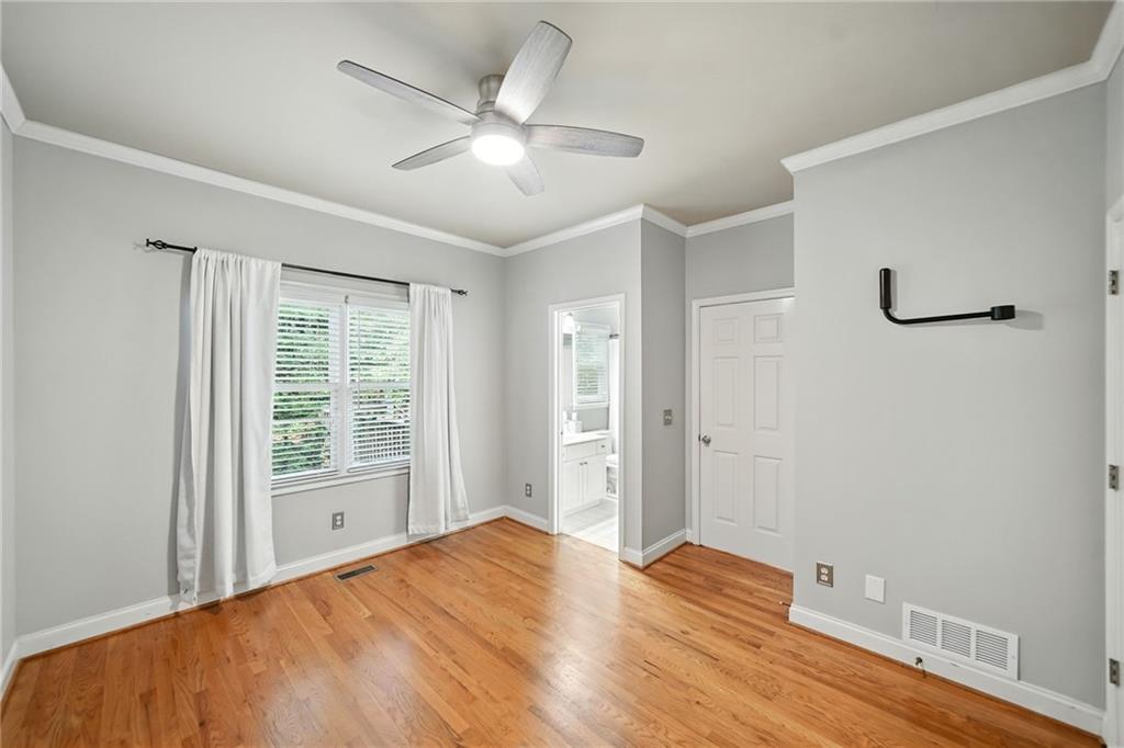 629 Gold Valley Pass Canton, GA 30114 - Photo 20 of 110 a view of a bedroom with wooden floor and window