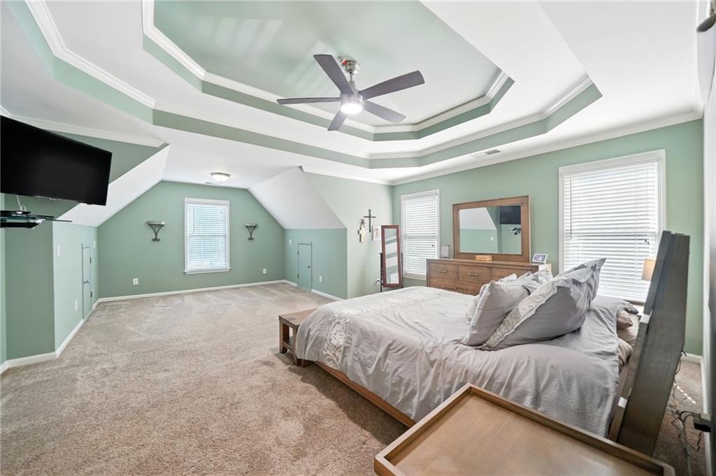 629 Gold Valley Pass Canton, GA 30114 - Photo 25 of 110 a bedroom with a large bed and a flat screen tv