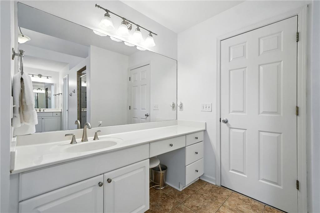 629 Gold Valley Pass Canton, GA 30114 - Photo 27 of 110 a bathroom with a sink and a mirror