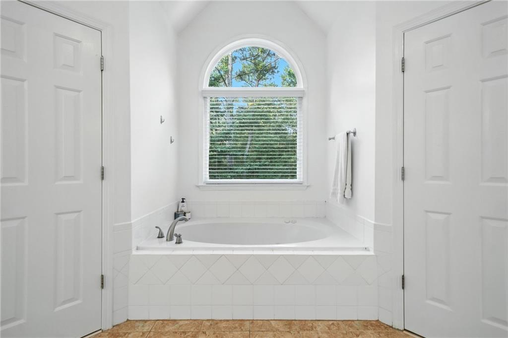 629 Gold Valley Pass Canton, GA 30114 - Photo 30 of 110 a white bath tub sitting next to a window