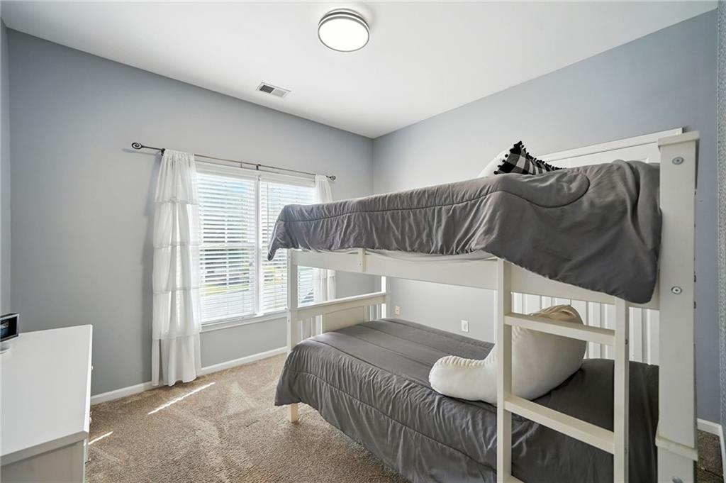 629 Gold Valley Pass Canton, GA 30114 - Photo 38 of 110 a bedroom with a bed and large window