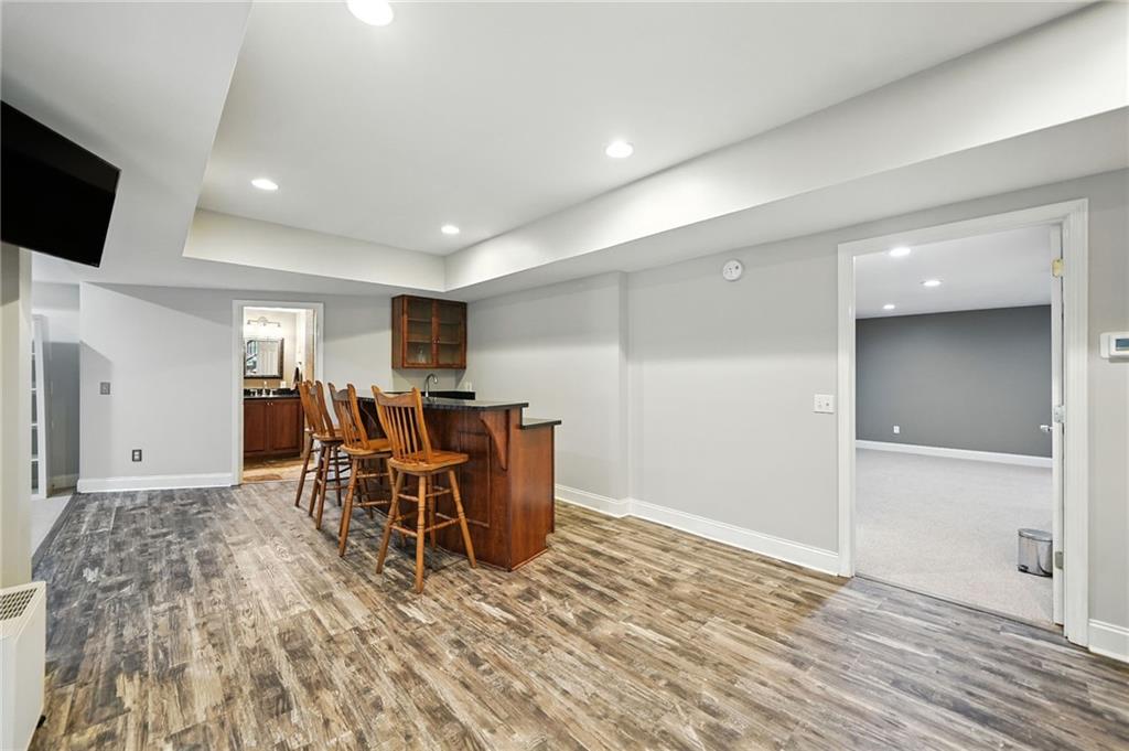 629 Gold Valley Pass Canton, GA 30114 - Photo 42 of 110 a view of a dining room with furniture and a flat screen tv