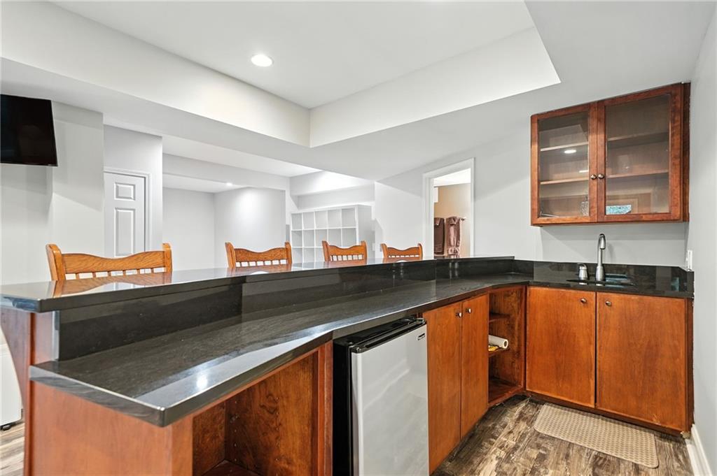 629 Gold Valley Pass Canton, GA 30114 - Photo 43 of 110 a kitchen with stainless steel appliances granite countertop a sink and cabinets