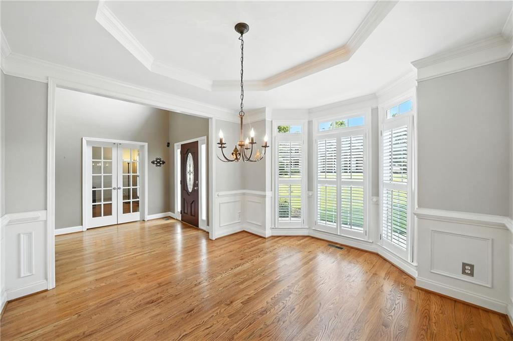 629 Gold Valley Pass Canton, GA 30114 - Photo 6 of 110 a view of a room with wooden floor and entryway