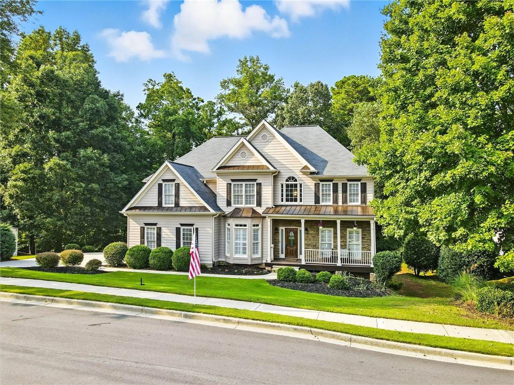 629 Gold Valley Pass Canton, GA 30114 - Photo 61 of 110 a front view of a house with a yard