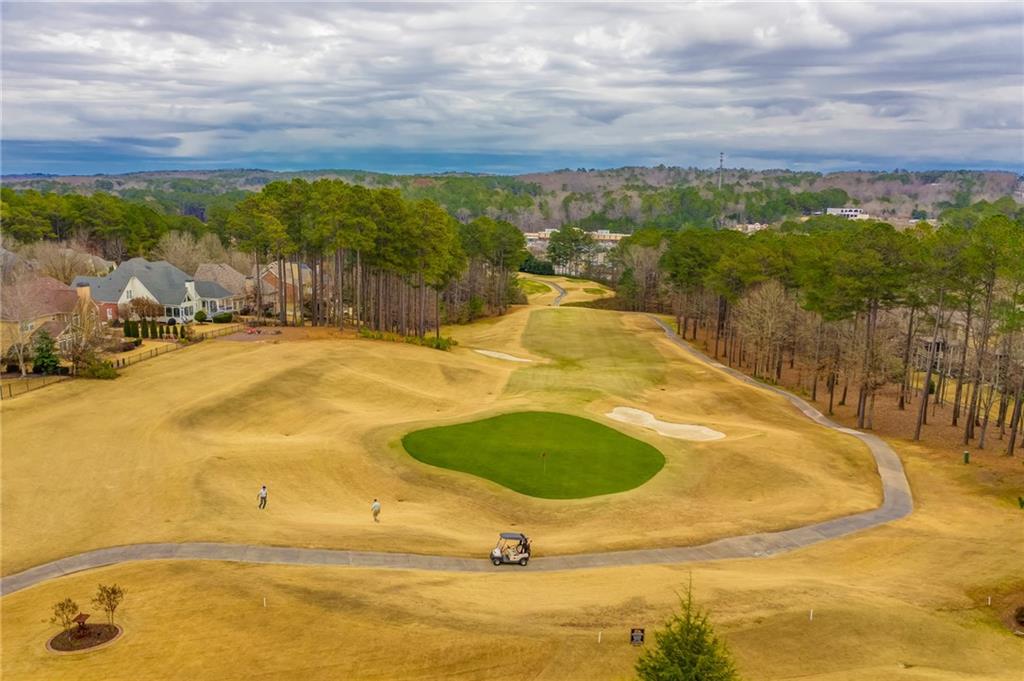 629 Gold Valley Pass Canton, GA 30114 - Photo 76 of 110 a view of a swimming pool with an ocean view