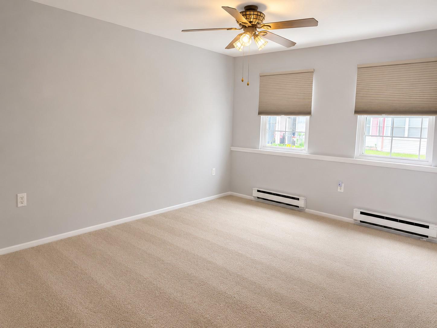 7006 Basswood Road Frederick, MD 21703 - Photo 9 of 10 an empty room with windows and fan