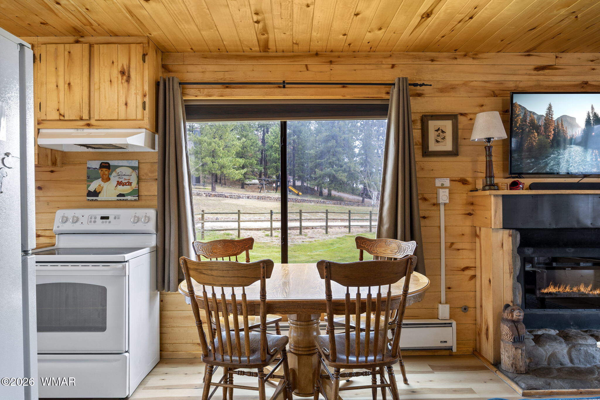 85 Main Street Greer, AZ 85927 - Photo 32 of 55 a view of a dining room with furniture window and outside view
